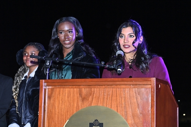 Students at the podium speaking at the St. John's Christmas tree lighting