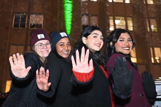 Four St. John's students having Hello 