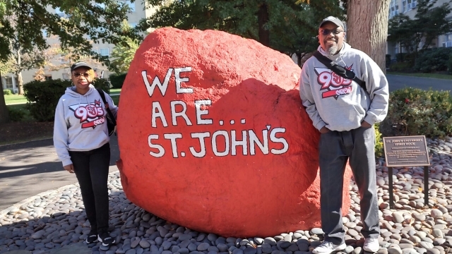 Angela and Woody standing infront of the We Are St. John's Spirit Rock 