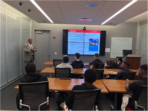 dr._bernard_jones_engages_with_the_young_students_during_his_presentation_on_critical_infrastructure_protection