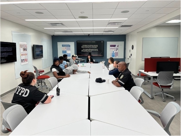 dr._tzu-ying_michelle_lo_and_the_explorers_analyze_bodycam_footage_as_she_teaches_them_about_community_policing