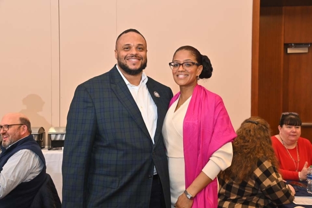 Two people pose for a photo