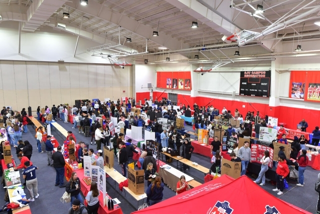 Birdseye view of Taffner Fieldhouse during 2024 Activities Fair with students learning about activities at tables