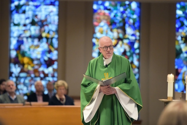 Fr. Shanley reading in church