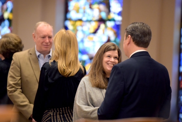 Couples facing each other in church