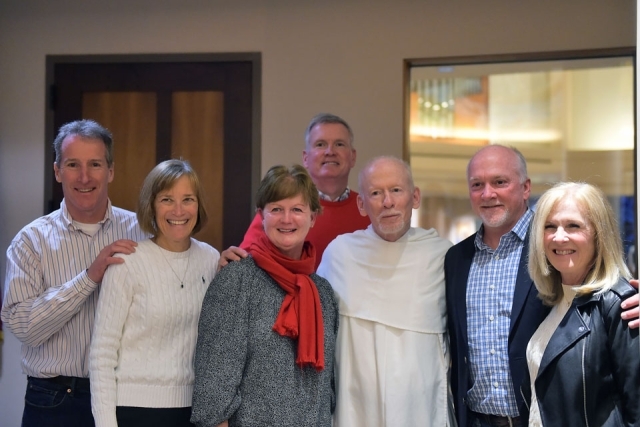 Couples pose for group photo in church