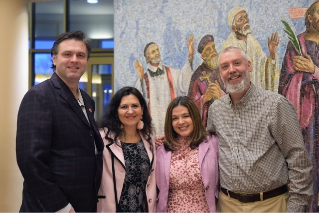 Couples pose for group photo in church