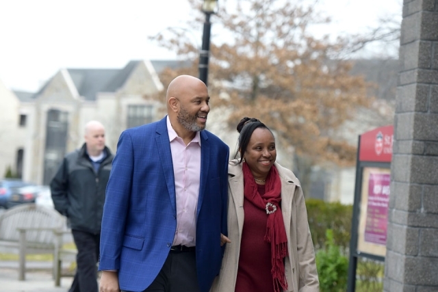 Couple walking on campus