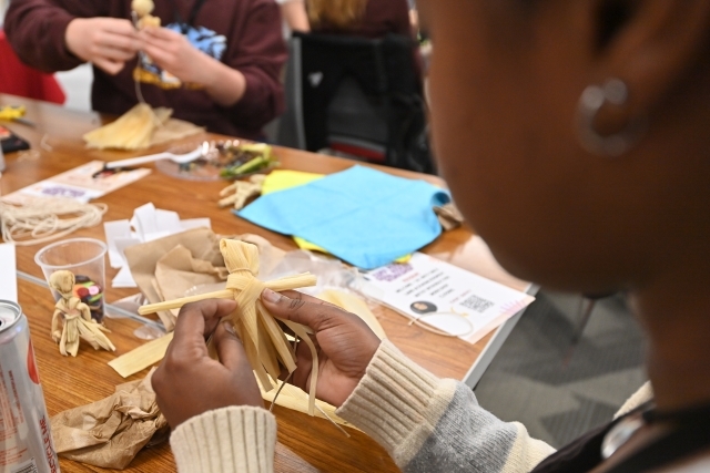 College student practicing mental health through arts and crafts 