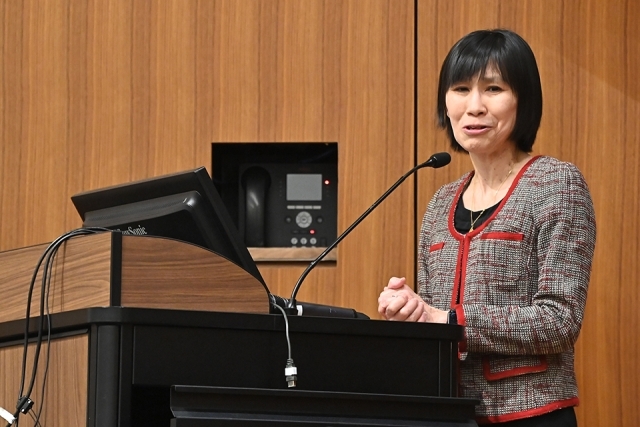 Dean Lin speaking at a podium