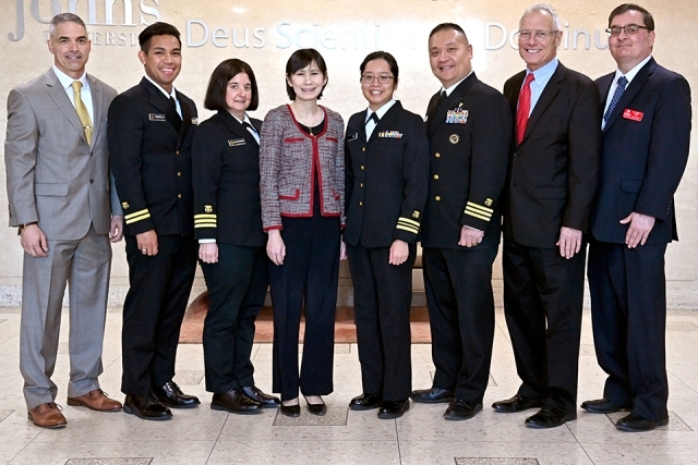Dean Lin and other individuals pose for a group photo 