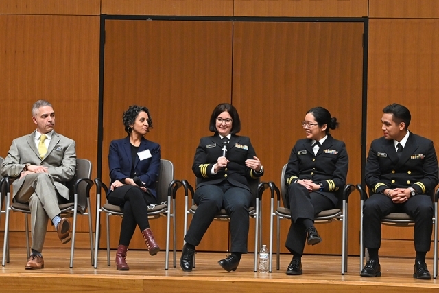 Panelists sitting onstage