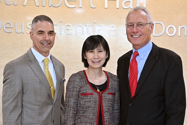 Dean Lin and two men pose for a photo
