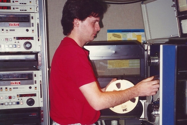 Michael Sheehan '87SVC working on tape machine at St. John's