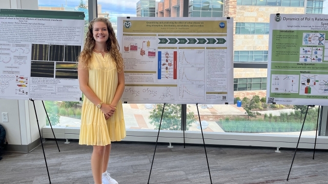 Audrey O'Connor standing in front of research poster 