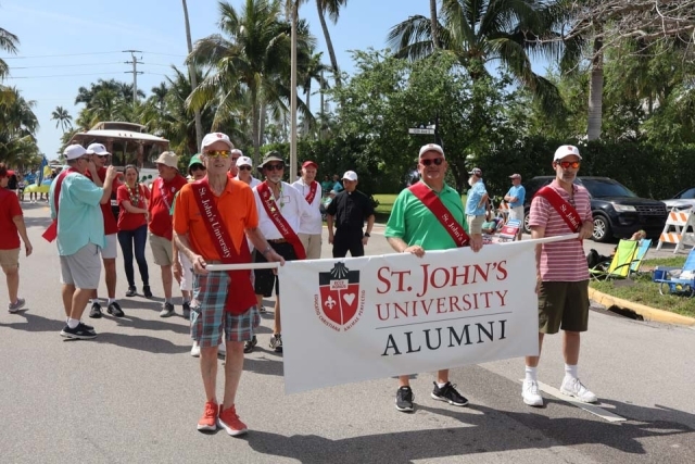 St. John's Alumni walking at St. Patrick's Day Parade in Florida