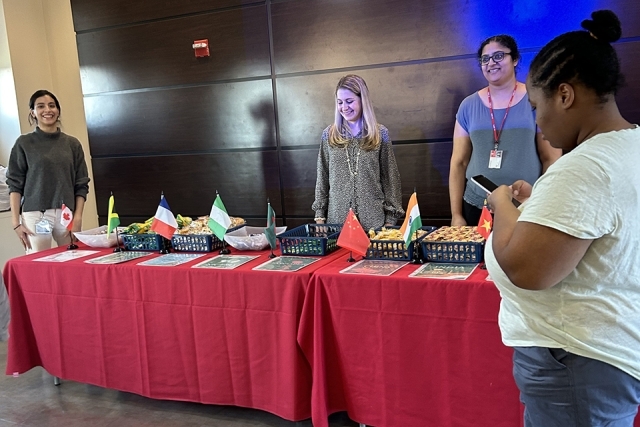 red table with an array of international flags and food samplings