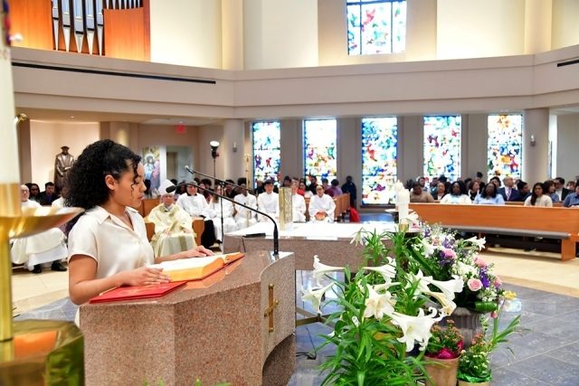 woman standing at podium in church
