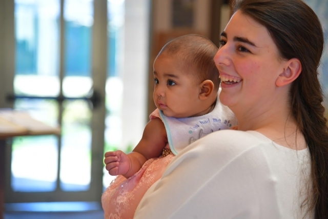 inset of woman holding a baby 