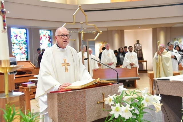 priest or Bishop speaking from podium