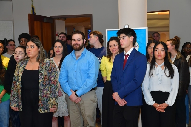 group of people standing inside church