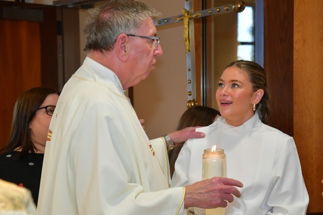 Altar server interacting with campus ministry member