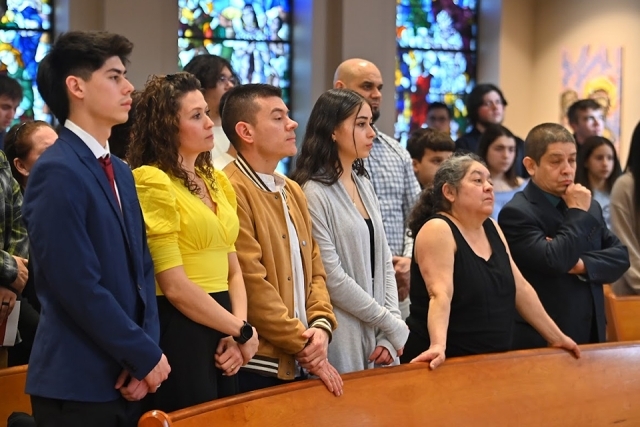 People standing in the pews