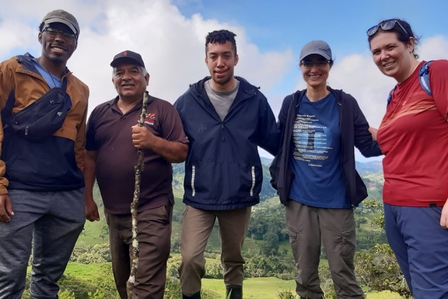 St. John's students on Plunge retreat pose for a photo with an adult