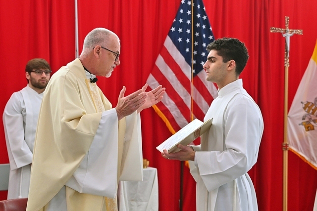 Altar server and Fr. Shanley during Mass