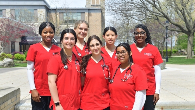 St. John's Nursing students standing infront of D'Angelo building on Queens campus