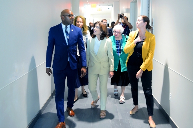 governor_hochul_walking_through_hallway_at_health_science_center_at_st._johns