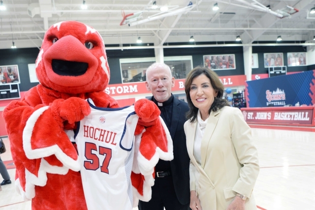 johnny_thunderbird_giving_governor_hochul_a_red_storm_jersey