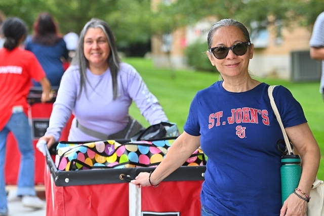 St. John's family members rolling carts