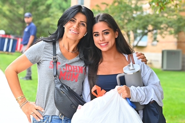 Mother and daughter pose for a photo