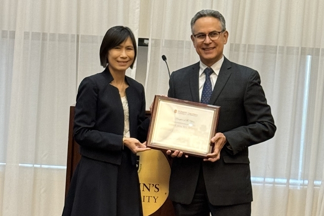 Dean Lin handing award out