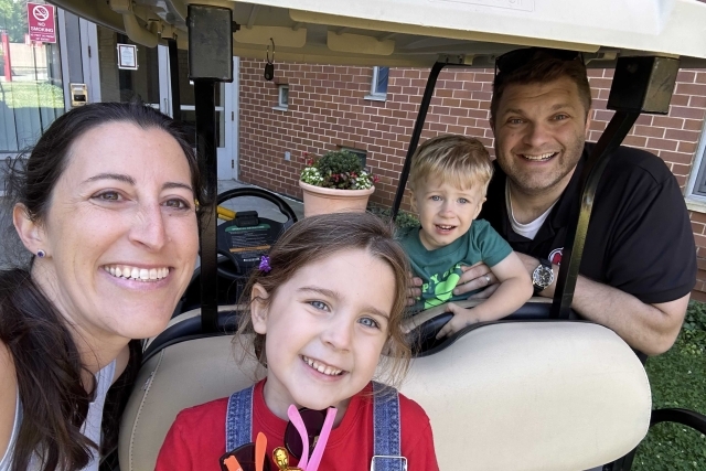 THE Bartletts Family in a golf cart on the St. John's University campus