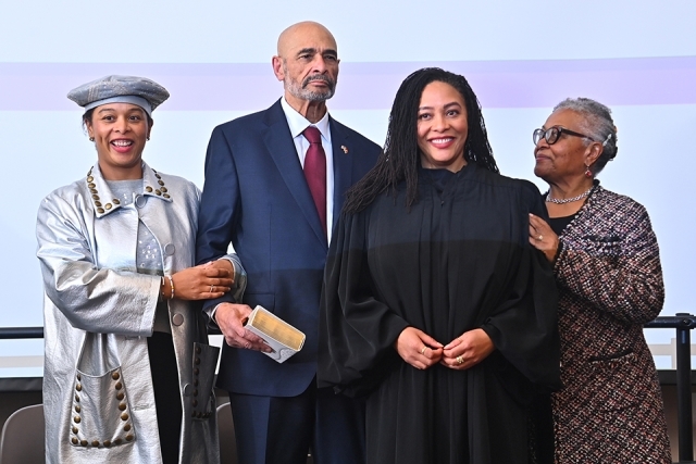 Cassandra A. Johnson ’03C, ’06L with guests at her induction ceremony