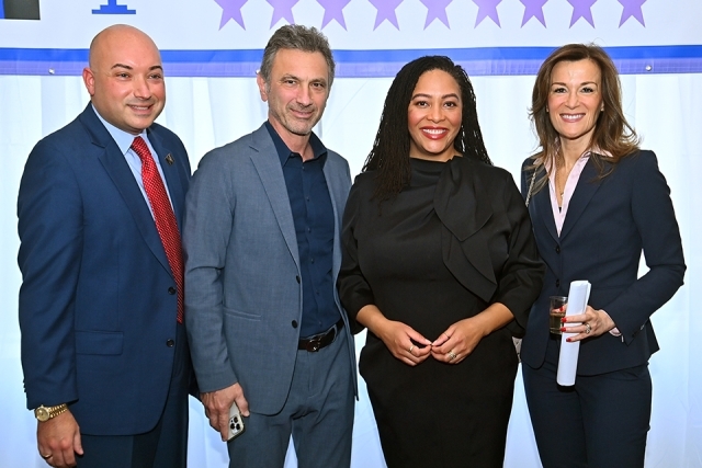 Cassandra A. Johnson ’03C, ’06L with three other guests are her induction ceremony