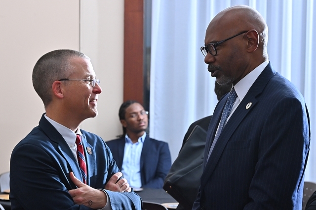Chris Vaupel and University employee chatting