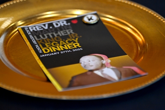 2025 MLK Dinner program on a gold plate