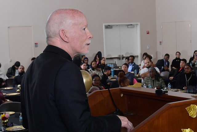 President Shanley speaking at podium