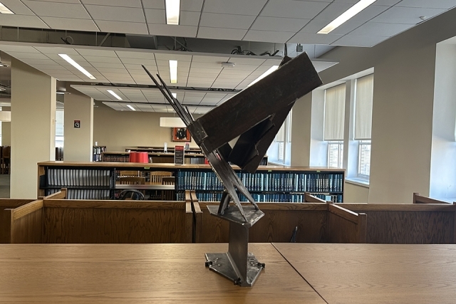 Vincent Michael Poast Sculpture in St. John's Library on table
