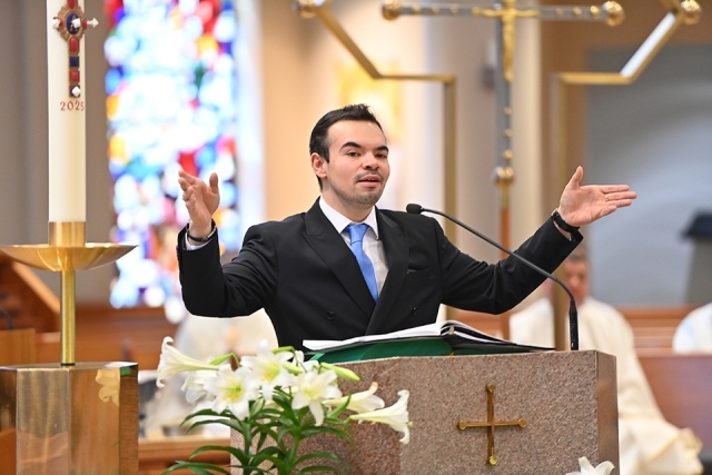 Cantor with his hands raised in church