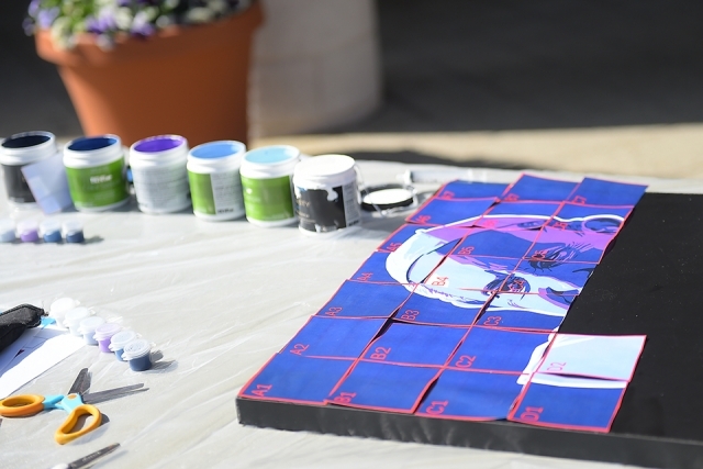 paints and mosaic squares on a table
