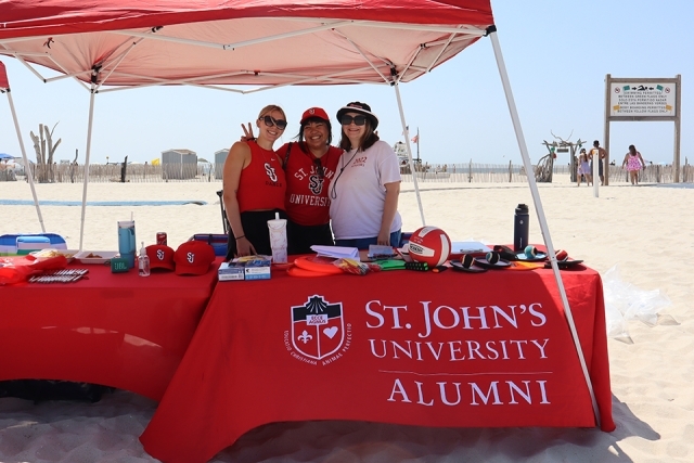 Signup tent for St. John's Alumni cleaning up the beach
