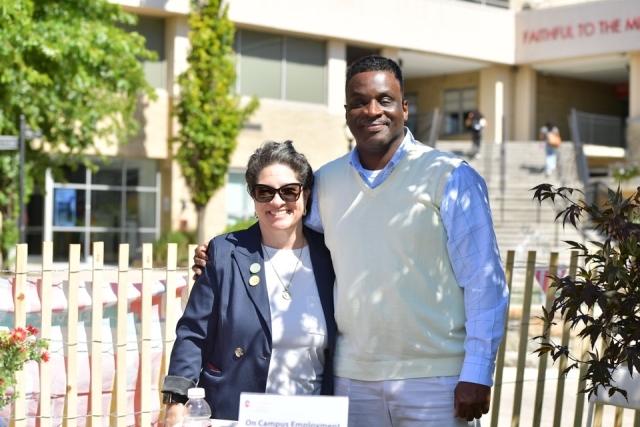 Male and female pose for a photo