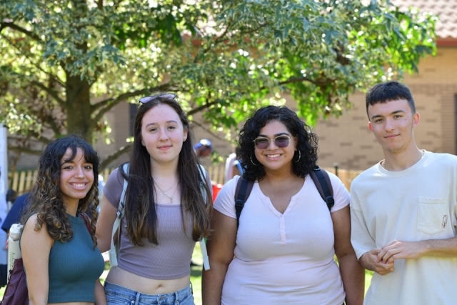 Four students standing