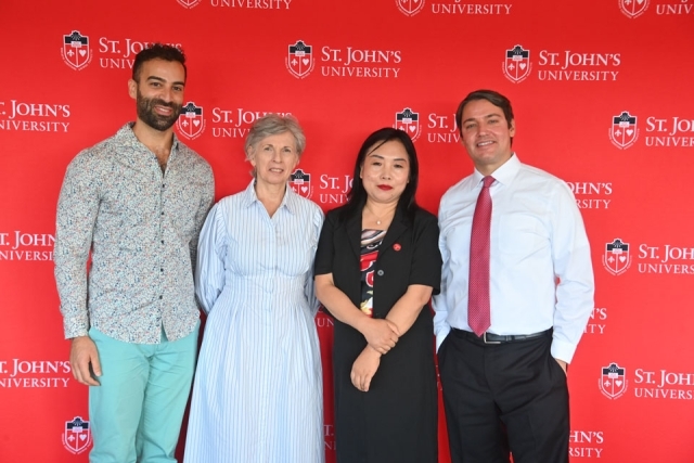 Four faculty members standing