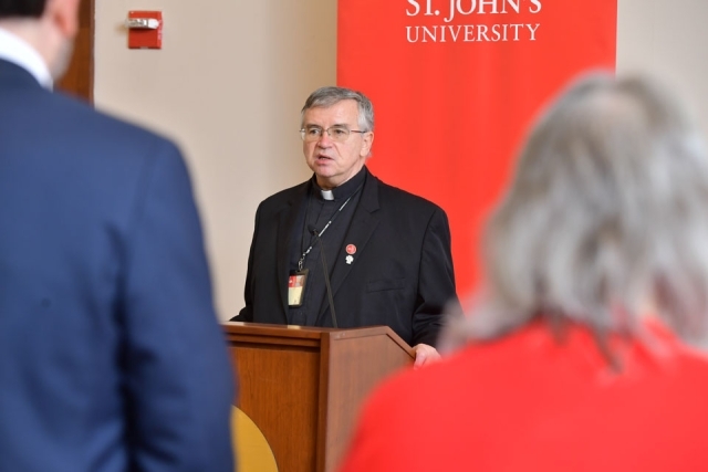 Fr. Griffin speaking at the podium 