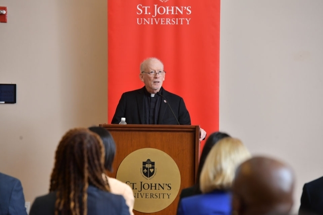 Fr. Shanley speaking at the podium 
